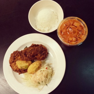 Kin & Comfort's fried chicken, som tam, fried green tomato, and Thai tea